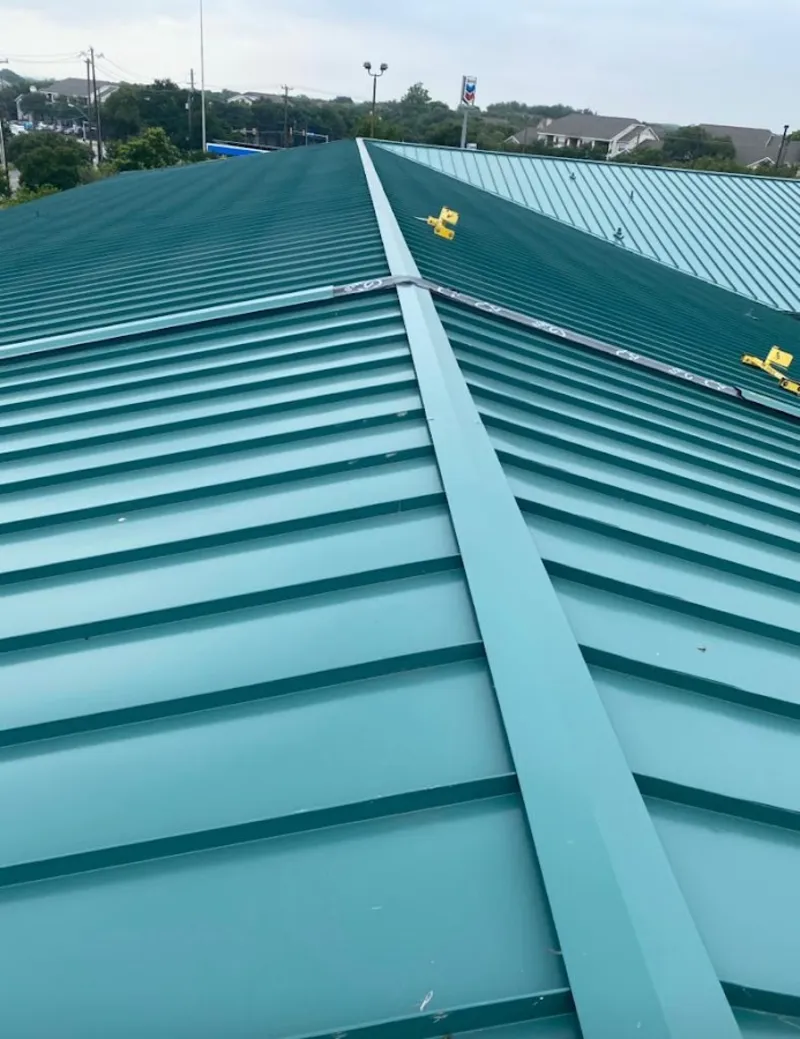 Green commercial metal roof ridge and valley for Metal Roof Repair in Applewood